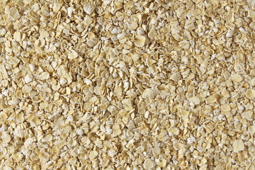 Wall Mural - Dry rolled oatmeal flakes as background top view