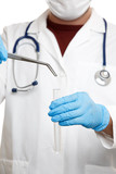 Fototapeta  - Photo of doctor in mask and white coat in rubber gloves holding tweezers and test tube.
