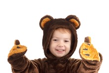 Child In A Christmas Carnival Bear Costume Isolated On White With Copy Space,  Carnival.