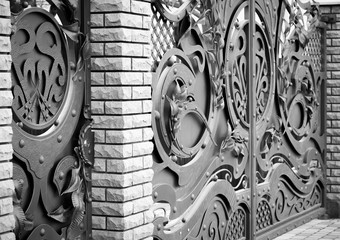 Wrought-iron gates, ornamental forging, forged elements close-up.