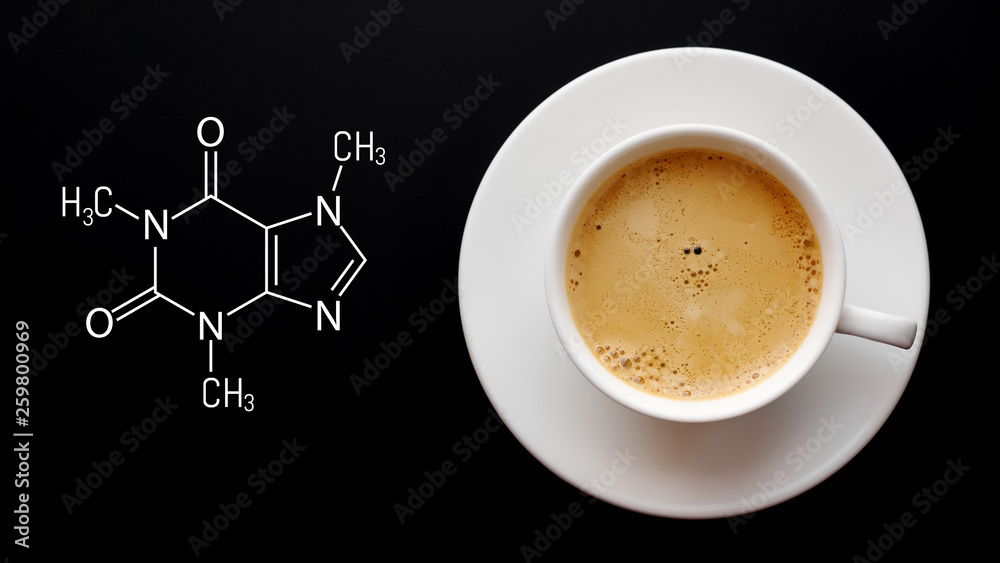 Cup of fresh coffee on a black background. Blackboard with the chemical formula of caffeine. Top view with copy space - obrazy, fototapety, plakaty 