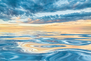 dawn or dusk over smooth water