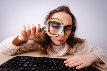 Funny nerd girl working on computer