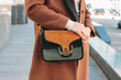 © Galina Zhigalova - Fashionable stylish woman in a beige coat with a trendy suede bag