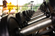 © arcyto - Rows of dumbbells at the fitness gymnasium for bodybuilding in the workout time.Selective focus