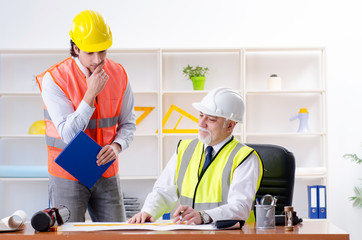 Two engineers colleagues working under project 