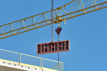 Construction site with yellow crane