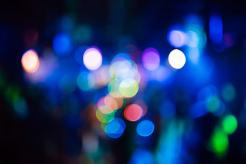 multicolored bokeh from bright colored spotlights in a nightclub