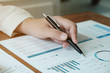 © Wanda - Business People Meeting Design Ideas  with pen analyzing financial documents professional investor working new start up project. Concept. business planning in office.