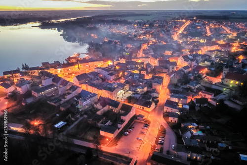 Town by the lake at sunset ...