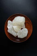 Polycrystalline rock sugar on black background