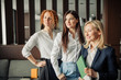 © alfa27 - Portrait of three caucasian business women with different hairstyle, dressed in formal wear posing in a hotel lobby