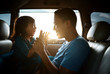 © Odua Images - asian daughter with father in the car playing