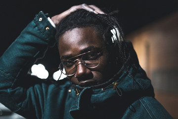 Portrait of young black man and handsome and modern in the street