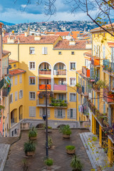 Wall Mural - Nice in France, building yard with typical colorful facades in the old town, French Riviera 