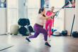 © MZaitsev - Fat woman works out in gym to lose weight