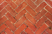 Paved Footpath. Old Red Brick Paving On A Sidewalk. Abstract Background