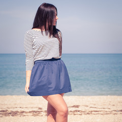 beautiful brunette woman on the beach