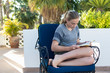 © Marc Romanelli - 12 year old girl reading on terrace, Todos Santos, Mexico