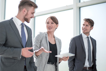 Wall Mural - employees discuss something standing in the office