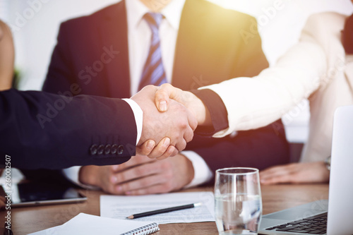 Fototapeta na szkło Business people shaking hands at meeting or negotiation in the office. Handshake concept. Partners are satisfied because signing contract