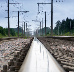 railway view with reflection along the rail