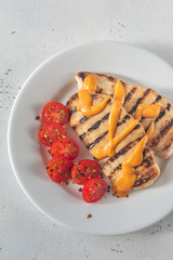 Wall Mural - Grilled chicken breast with cherry tomatoes