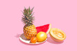 © Tegan Isha  - Assortment of Tropical Fruit on Pink Background, Copy Space