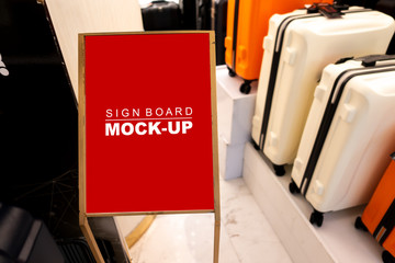 Mock up signboard advertising standing in luggage shop