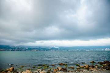 Stormy clouds under the Black sea. Themes bay in Novorossiysk in Krasnodar region, Russia. Image of sea trading port