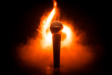 Microphone karaoke, concert . Vocal audio mic in low light with blurred background. Live music, audio equipment. Karaoke concert, sing sound. Singer in karaokes, microphones.