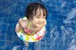 Leinwandbild Motiv Asian Little Chinese Girl Playing in Swimming Pool
