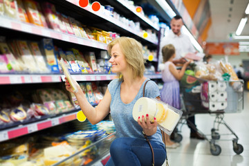 Woman holding variety of cheese