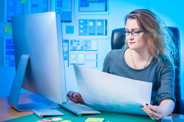 Girl graphic designer develops the concept of a mobile application. ux Graphic designer sketch for web mobile phone. Test and Discuss New App Features. Office of the designer.