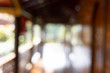 © momolelouch - Blurry backgroud of woodend house with green nature out of terrace.
