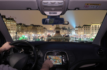 Wall Mural - Driving using GPS towards  Trafalgar Square at night, London, UK