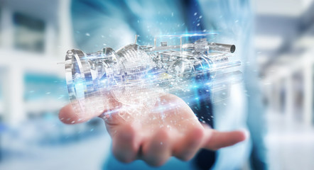 Poster - businessman using wireframe holographic 3d digital projection of an engine
