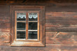 The old window of old wooden house. Background of wooden walls
