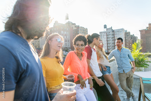 Fotografía Group of friends having party on a rooftop