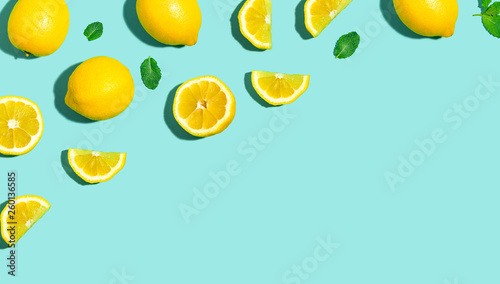 Cuadros en Lienzo Fresh lemon pattern on a bright color background flat lay