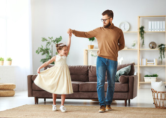 Wall Mural - Happy father's day! family dad and child daughter Princess dancing.