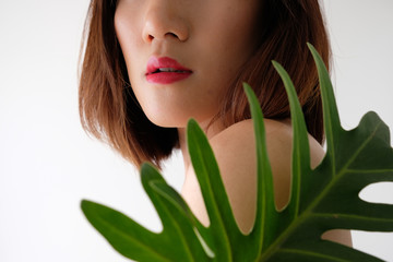 Young beautiful woman applying make up.