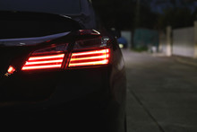 Red Taillight Of Modern Sport Car In The Night Street