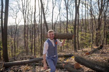 one young man, dressed in suit, carrying wood log on his shoulder.