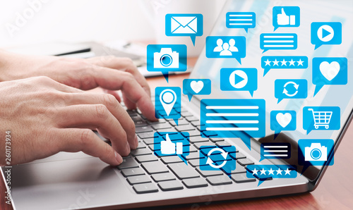 Cuadros en Lienzo Using laptop for social media. Laptop and many application icons.