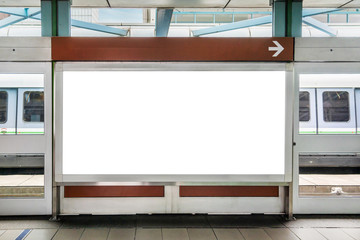 Blank billboard LCD advertisement for adjust your message in electric train station, mockup selective focus with clipping path.