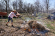 © Xalanx - Woman farmer burning cut branches and leaves