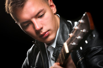 Wall Mural - Young men playing the guitar