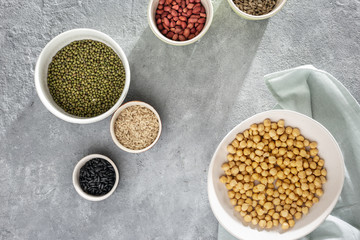 Canvas Print - Cereals with seeds peanuts concrete surface top view