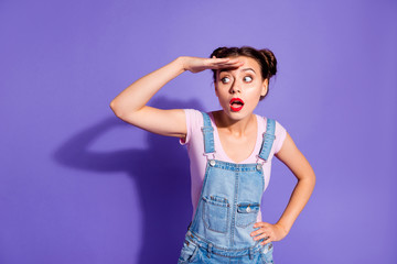 Wall Mural - Close up photo beautiful amazing yell she her lady buns look side empty space wondered sight wait guests bus stop wear casual t-shirt jeans denim overalls clothes isolated purple violet background